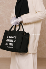 “A Women’s Jewelry Is Her Haya” Black Cotton Tote Bag - Gift